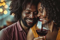 Happy black woman couple celebrating embracing drinking portrait.