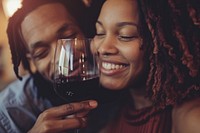 Happy black woman couple celebrating drinking portrait wine.