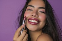 A latina Mexican model lipstick cosmetics holding.