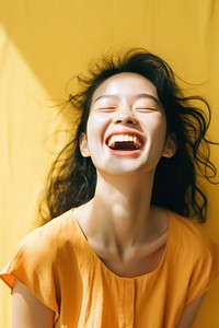 Chinese woman smiling laughing excitement relaxation.