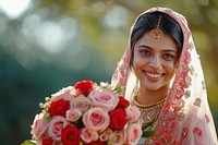 A joyfully smiling indian female rose fashion wedding.