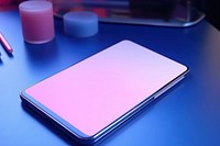 Smartphone with abstract holographic computer table pink.