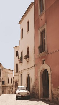 Old italian town architecture building vehicle. AI generated Image by rawpixel.