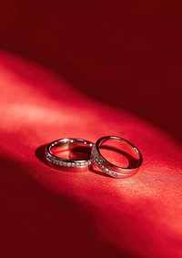 Couple ring jewelry red red background.
