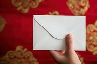 Envelope  holding paper mail.