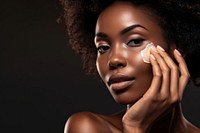 Black woman with a healthy glowing skin portrait applying adult. 