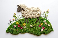 A sheep embroidery flower grass.