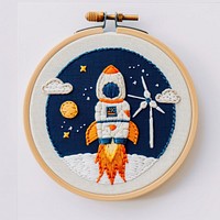 An astronaut embroidery pattern rocket.