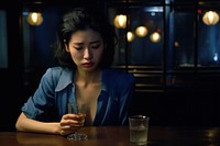 Young female crying in the bar drinking table adult.