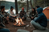 Latino group outdoors camping bonfire.