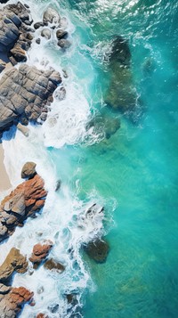  Close up rocky beach nature outdoors ocean. AI generated Image by rawpixel.