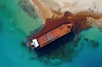 Oil tanker on the beach leaking oil shipwreck outdoors vehicle. AI generated Image by rawpixel.