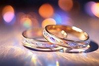 Wedding ring pattern bokeh effect background jewelry light gold.