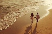 Indian young couple walking beach outdoors.