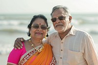 Indian senior couple Happy sunglasses portrait outdoors.