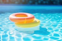Rubber rings floating on swimming pool summer outdoors inflatable.