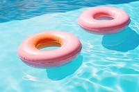 Rubber rings floating on swimming pool summer inflatable swimwear.