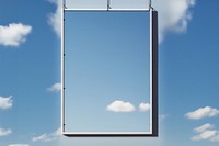 White a0 vertical poster on wire mesh sky outdoors nature cloud.