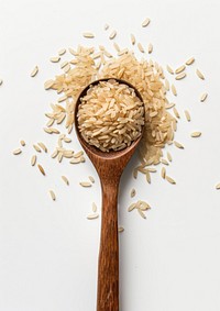 Brown rice in wood spoon food white background ingredient.