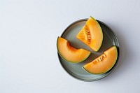 Two cantaloupe Slices on Plates melon fruit slice.