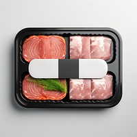 Sealable black plastic tray with raw meat schnitzels and blank label  packaging lunch food meal.