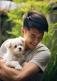 Taiwanese man playing with a pet portrait mammal animal.