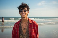 Indian teen age man beach sunglasses portrait.