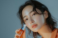 Korean women cosmetics bottle hairstyle.