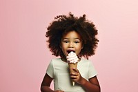 Black little girl eating food dessert cream.