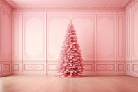 Pink christmas tree in empty pink room architecture illuminated celebration.