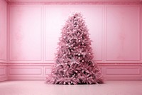 Pink christmas tree in empty pink room plant celebration decoration.