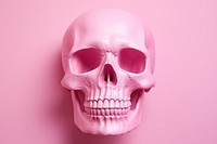 Pink simple skull on empty pink background human anatomy purple.