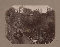 Gezicht op de Tsuten-kyo brug met op de voorgrond mensen die zitten op plateaus, in Kyoto, Japan (c. 1890 - in or before 1903) by anonymous