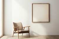 A chair by a woodframe frame  in an empty home furniture armchair canvas.