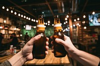 Craft beer bottle drink hand. AI generated Image by rawpixel.