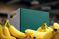 Banana by green supermarket box