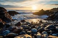 Rocky beach sunset landscape outdoors horizon. AI generated Image by rawpixel.