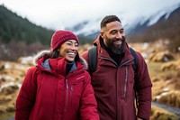 Samoan couple hiking laughing outdoors travel.