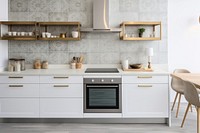 White kitchen with wooden floors oven appliance furniture.