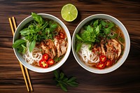 Vietnamese pho noodle bowls soup table food meal.