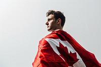 Man wrapped in canadian flag adult patriotism portrait. AI generated Image by rawpixel.