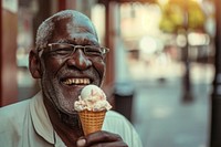 Man eating ice cream cone dessert glasses adult.