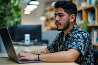 Mexican man working on a laptop computer office adult. 