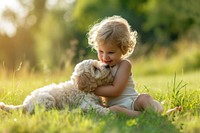 Puppy and a child playing outdoors portrait mammal.