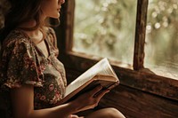 Woman reading the bible publication sitting book. 