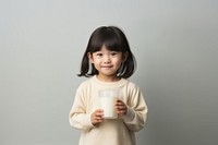 Asian little girl milk drinking portrait.