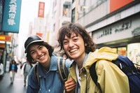 Happy Backpackers in tokyo laughing jacket smile.