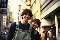 Happy Backpackers in tokyo photo city togetherness.