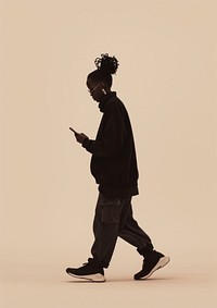 Person holding phone photography silhouette walking.