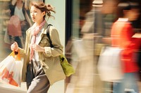 Motion blur middle age woman carrying shopping bag portrait handbag adult.